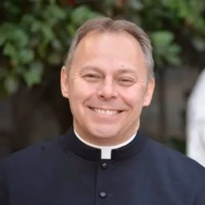 The Reverend Father Steven H. De Muth